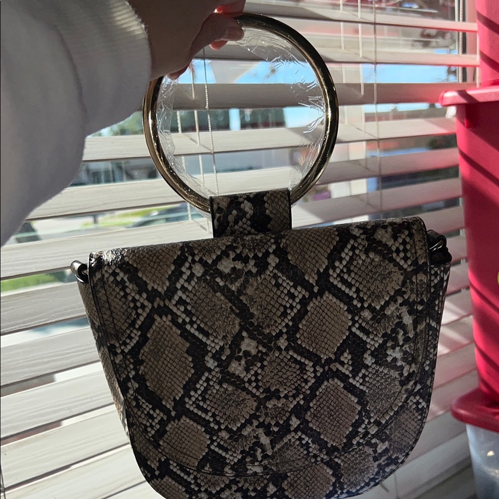 Chic Snakeskin Pattern Handbag with Gold Accents
